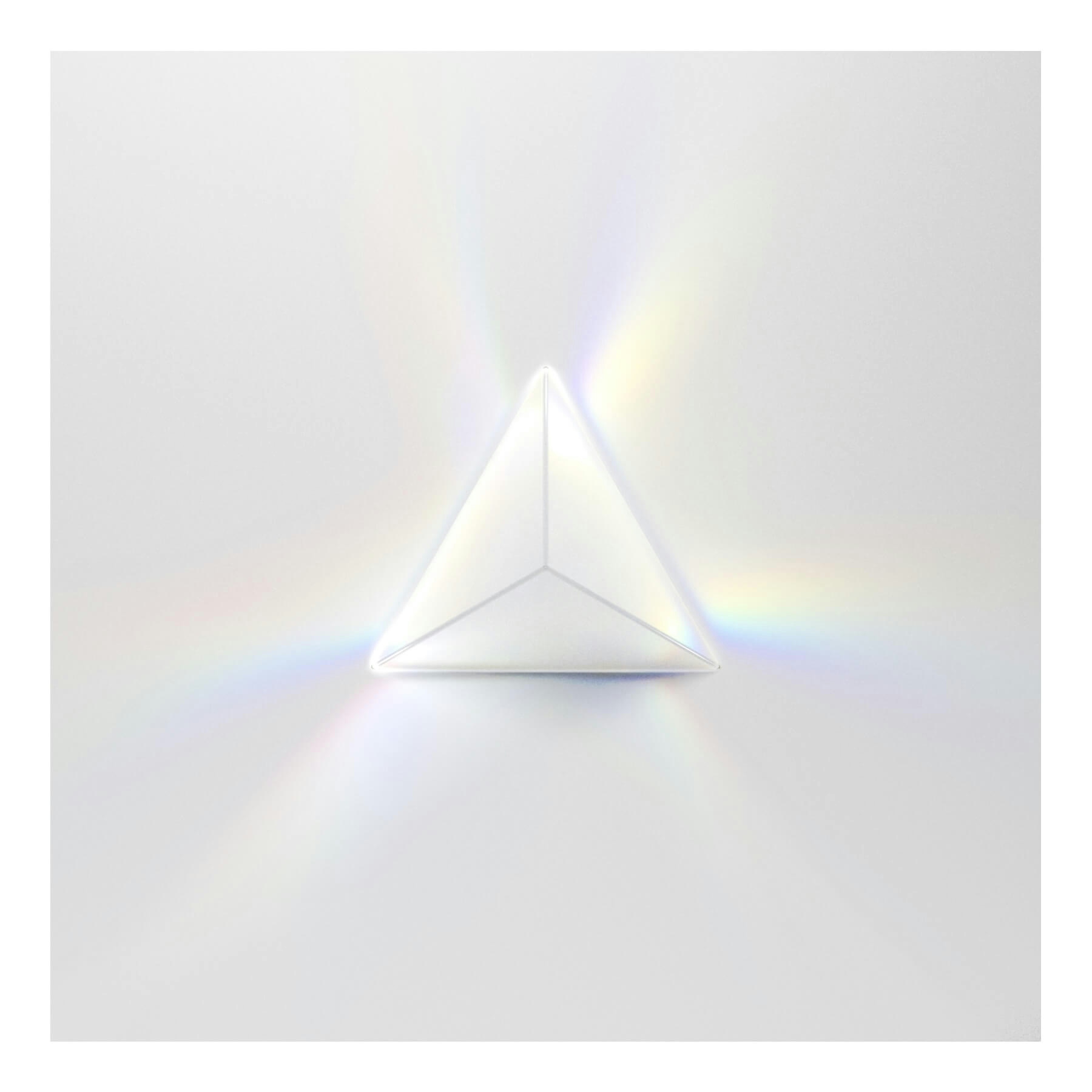 A black and white theme featuring an image of light rays exiting a prism in 3 directions. The light rays are not vertical but leave the prism at various angles, creating a dynamic composition.